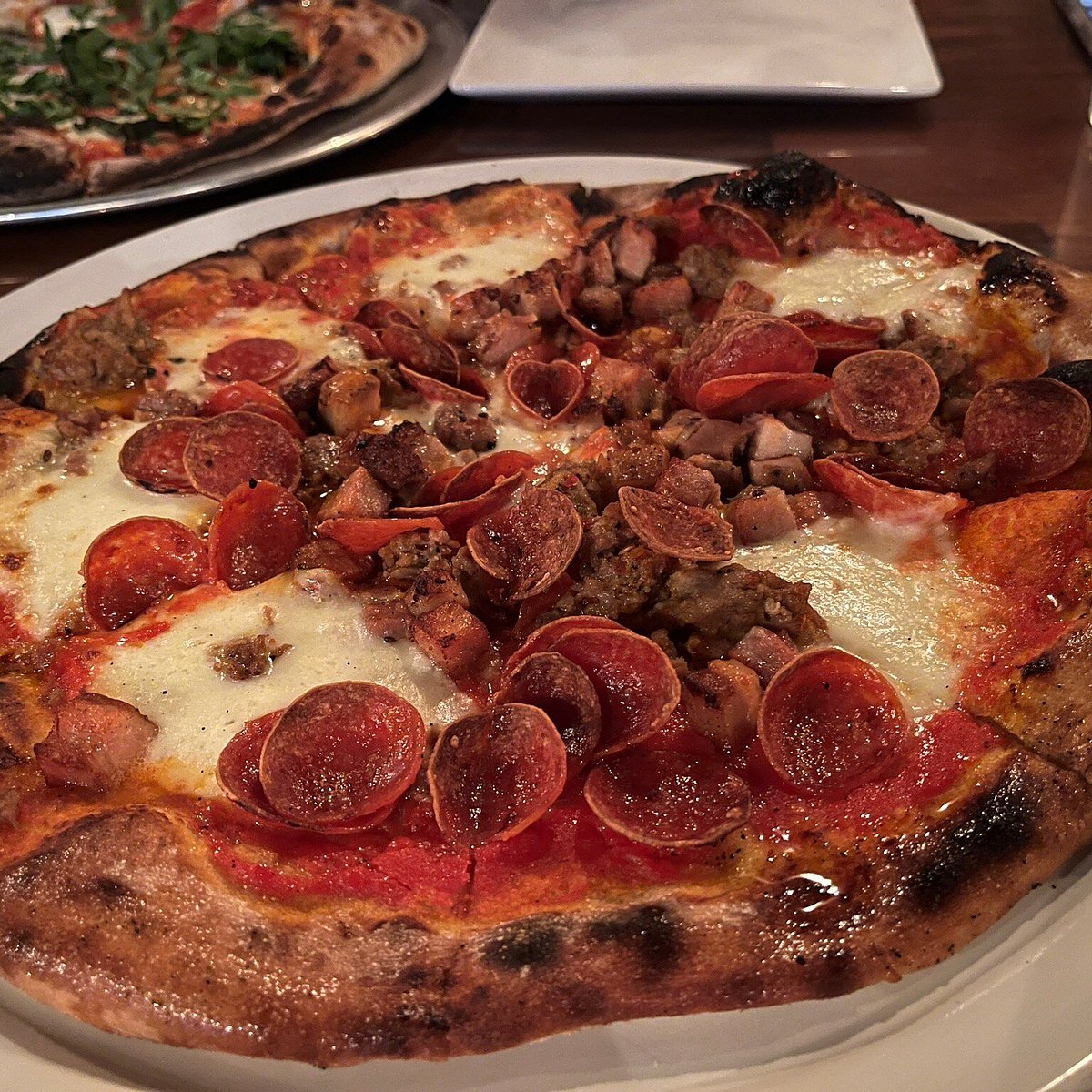 Proper Brick Oven & Tap Room signature dishes Carnivore PizzaForest PizzaBacon Candy